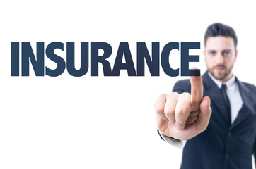 Business man pointing the text: Insurance