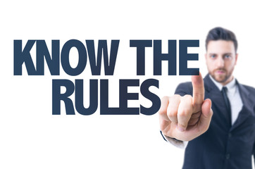 Business man pointing the text: Know the Rules