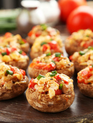 Stuffed mushrooms on cutting board