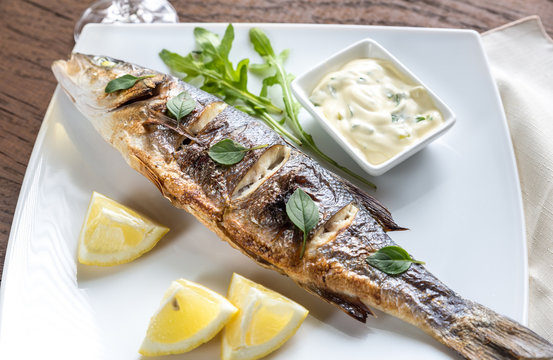 Grilled seabass on the wooden board