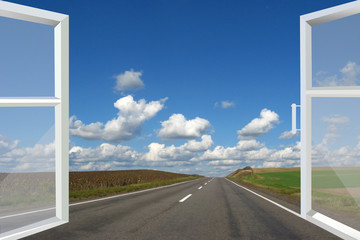 window opened to the asphalted road