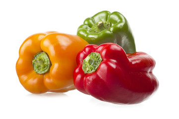 Obraz na płótnie Canvas colored peppers close up over white background