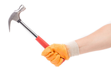 Man's hand in glove holding hammer.