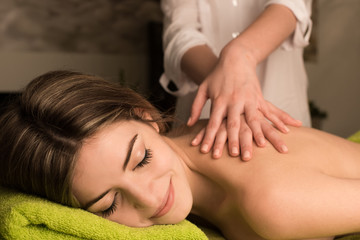 Fototapeta na wymiar Woman having back massage