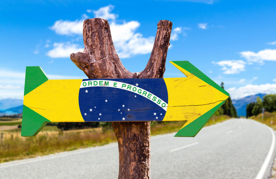Brazil Flag wooden sign with road background