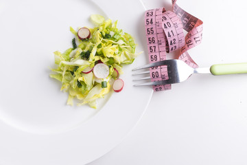 Fototapeta na wymiar Healthy salad. Diet. Ideal waistline.