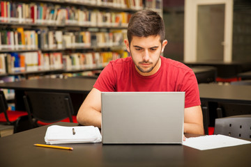 Busy student using a laptop