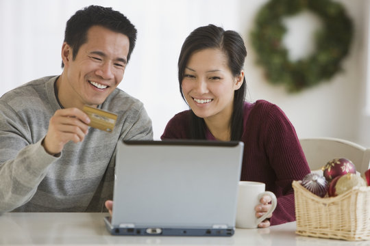 Asian couple shopping online