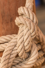 Fototapeta na wymiar Old fishing boat rope with a Tied Knot