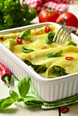 Cannelloni - baked pasta stuffed with spinach,chicken and cheese