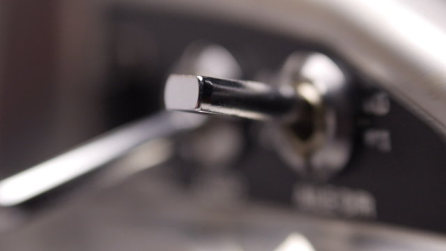 Toggle switch to position on and off. Closeup