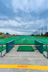 Golf driving range stations above ground