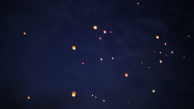 Sky paper lanterns flying into deep blue sky