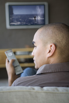 African American man watching television