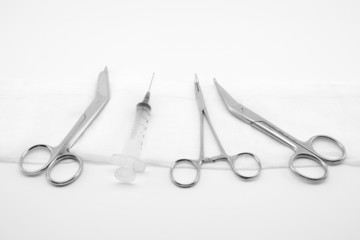 surgical composition with instruments and syringe