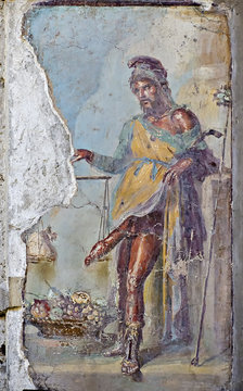 Fresco of Priapus with erect penis, Vettii houses, old ruins of Pompeii.