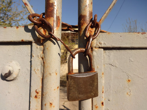 Clasp-lock on a rusty metal Door