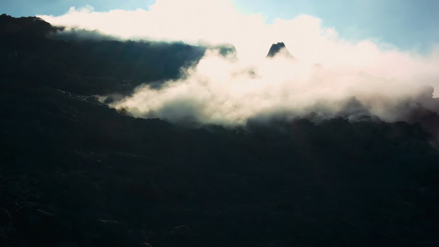 Volcano&rsquo;s island fumarole releasing white steam