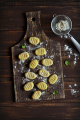 potato gnocchi on a dark surface in a vintage style