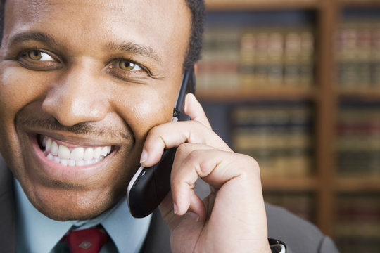 African American businessman talking on cell phone