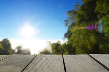 Defocused and blur image of terrace wood and beautiful forest