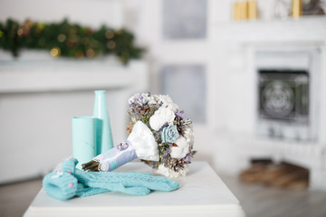 Winter wedding bouquet with mittens.