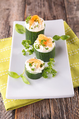 appetizer with cucumber,cheese and salmon
