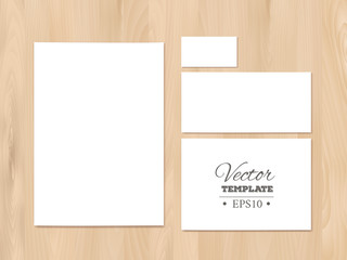 Corporate identity templates on a wooden background. Stationery 