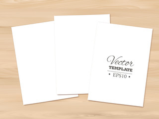 Template of blank paper sheet on a wooden background