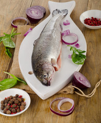 Raw Rainbow trouts on   rustic wooden table