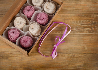 Homemade marshmallow - Zephyr in  box on wooden table.