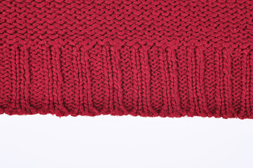 Burgundy knitted sweater close up, isolated on white