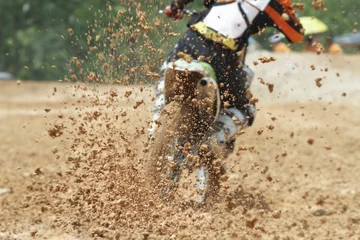 Fototapeten Mud debris flying from a motocross race © toa555