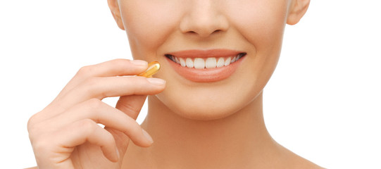 beautiful woman with omega 3 vitamins