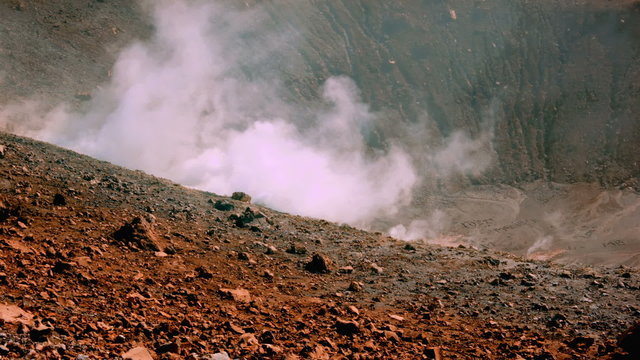 Volcano&rsquo;s island fumarole releasing white steam