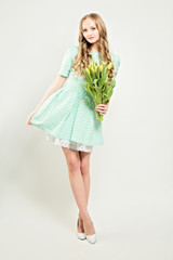 Fashion Young Woman with Tulip Flowers