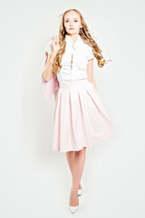 Elegance Woman Wearing Light Pink Suit. Fashion Photo