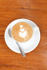 Cup of cappuccino coffee wood background