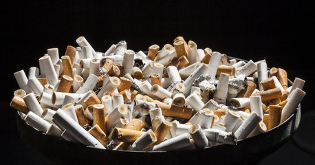 Stop smoking - Ashtray full of cigarette ends
