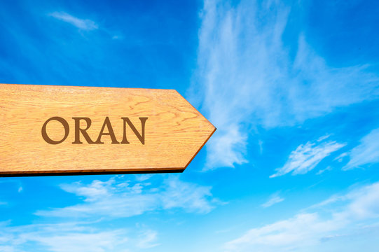Wooden arrow sign pointing destination ORAN, ALGERIA