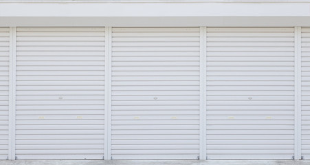 Exterior of white storage unit or small warehouse for rental .