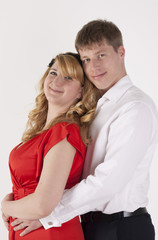 A couple in one´s best clothes. White background. Isolated.