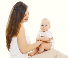 Portrait of happy mother playing with cute baby