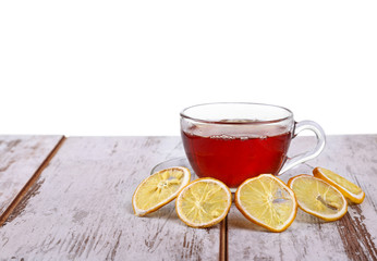 Glass cup with tea and a lemon on isolated on white 