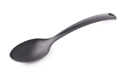 Black plastic kitchen ladle spoon isolated