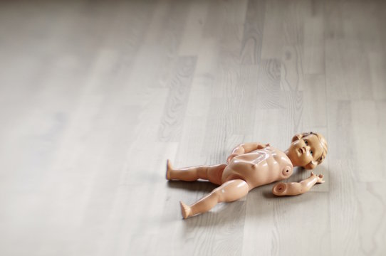 Broken Doll On The Floor