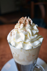 Viennese coffee in glass cup with whipped cream