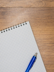 Notebook and pen lying on the table