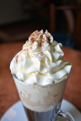 Viennese coffee in glass cup with whipped cream