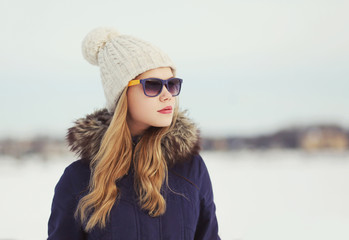 Portrait of beautiful woman outdoors in winter day